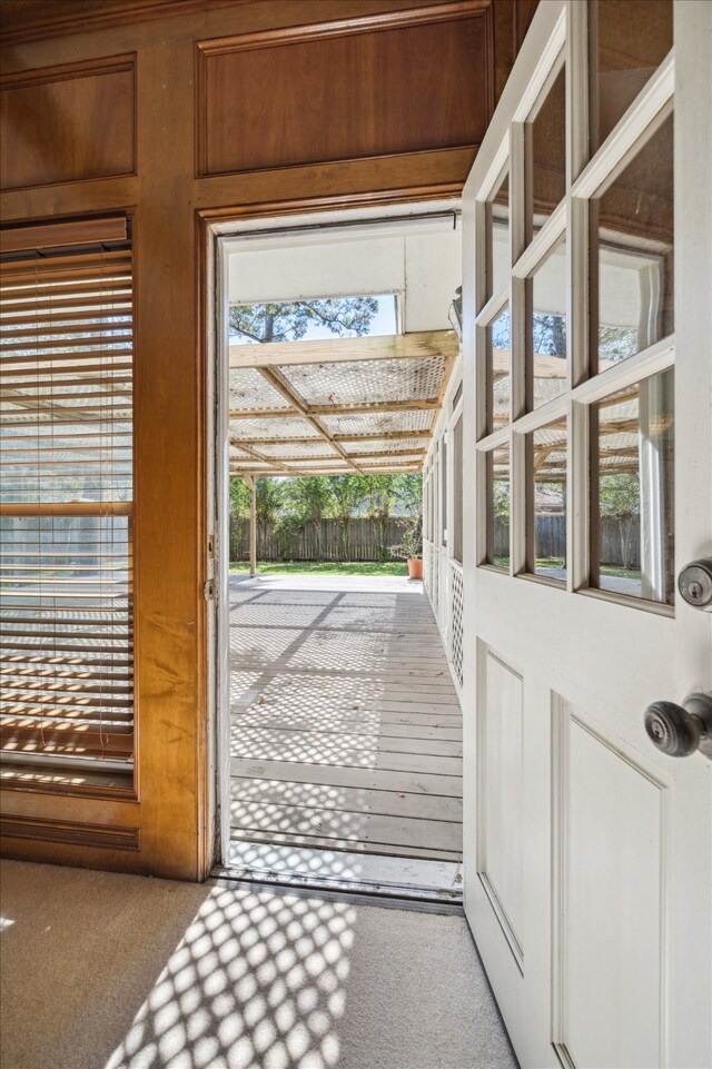 doorway with light carpet