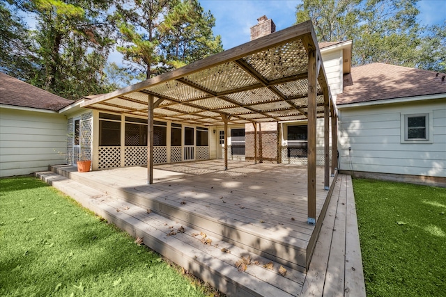 wooden deck with a lawn