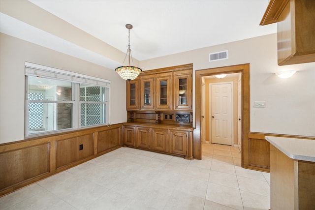 unfurnished dining area with light tile patterned floors