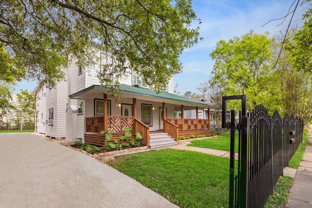 view of front of home with a front lawn and covered porch