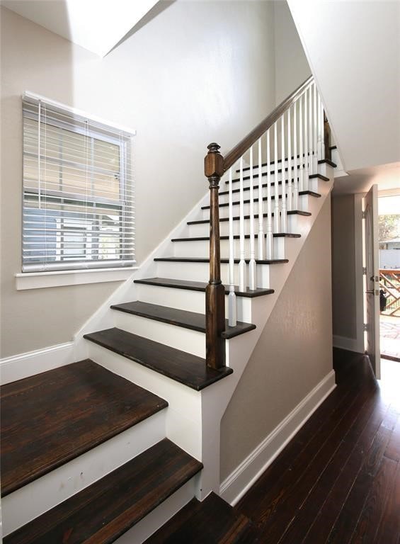 stairway with wood-type flooring