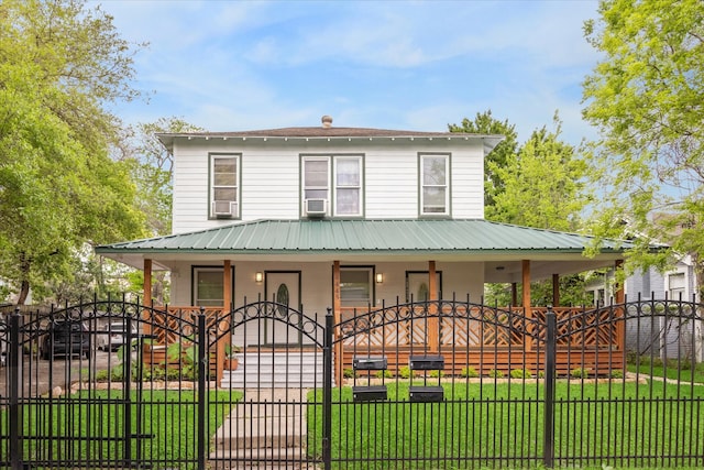 country-style home with a front yard, cooling unit, and covered porch