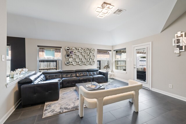 tiled living room featuring lofted ceiling