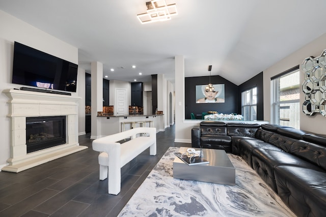 living room with lofted ceiling and dark hardwood / wood-style flooring