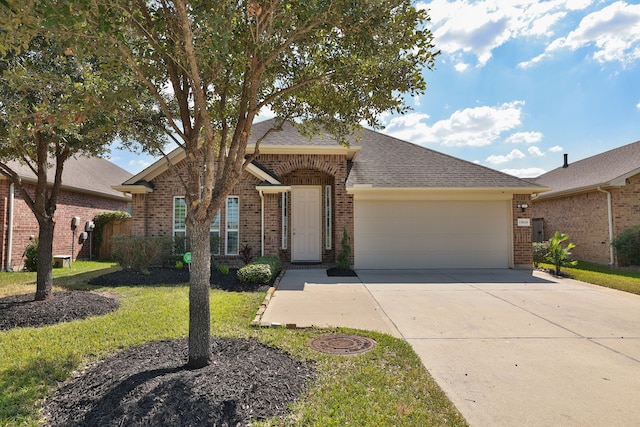 ranch-style house featuring a front lawn and a garage