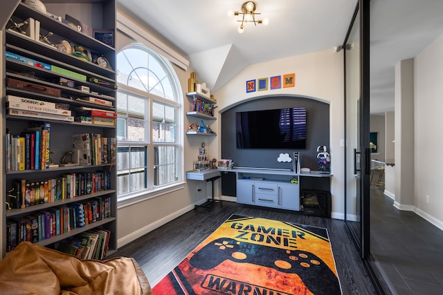 interior space with lofted ceiling and dark hardwood / wood-style floors