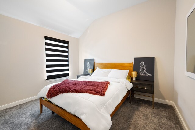 carpeted bedroom featuring vaulted ceiling