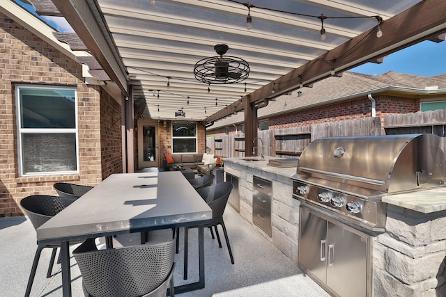 view of patio / terrace with sink, exterior kitchen, and area for grilling