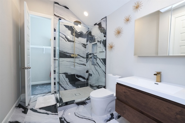 bathroom with vanity, lofted ceiling, a shower with shower door, and toilet