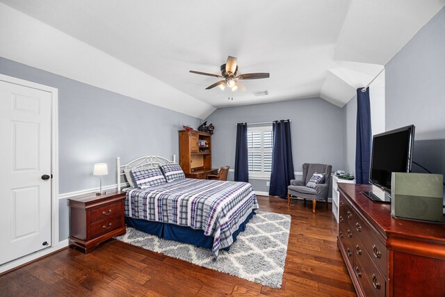 bedroom featuring dark hardwood / wood-style floors, ceiling fan, and vaulted ceiling