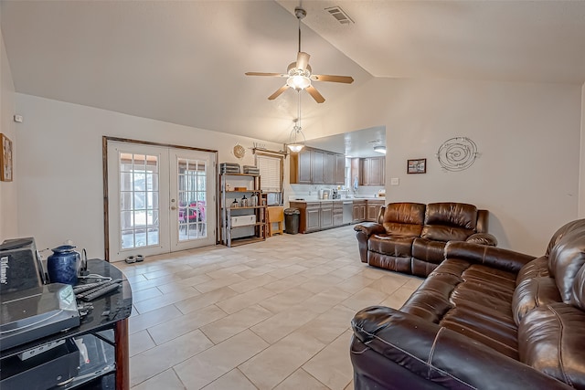 living room featuring french doors, high vaulted ceiling, light tile patterned floors, and ceiling fan