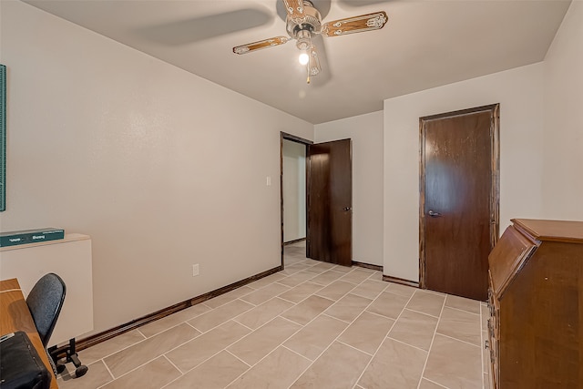 interior space with light tile patterned flooring and ceiling fan