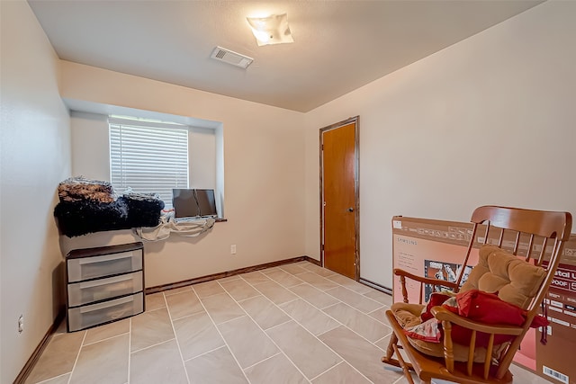 living area featuring light tile patterned floors