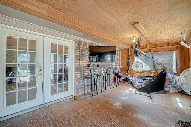 interior space with french doors and wooden ceiling