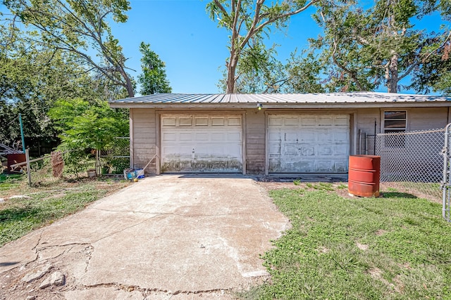 garage featuring a yard