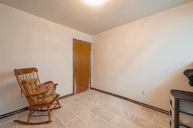 sitting room featuring light tile patterned floors