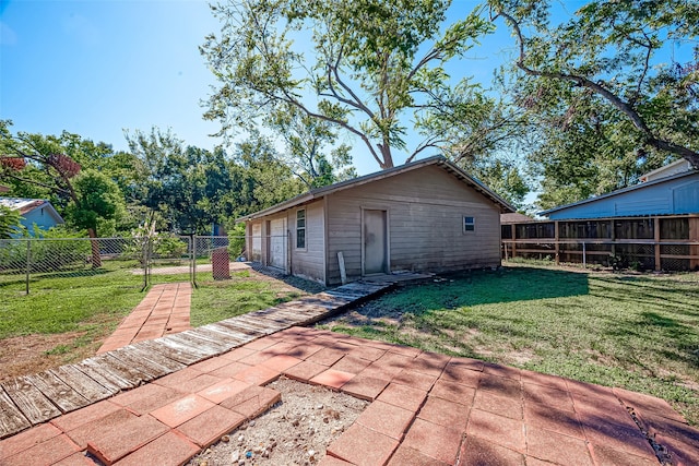 exterior space with a lawn and a patio