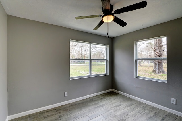 unfurnished room featuring ceiling fan and light hardwood / wood-style floors