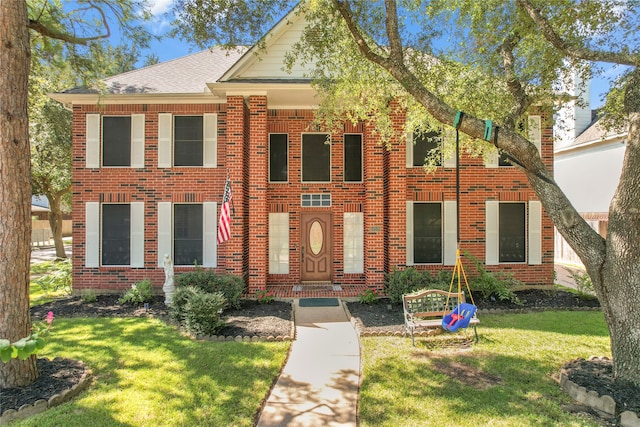 view of front of property with a front lawn