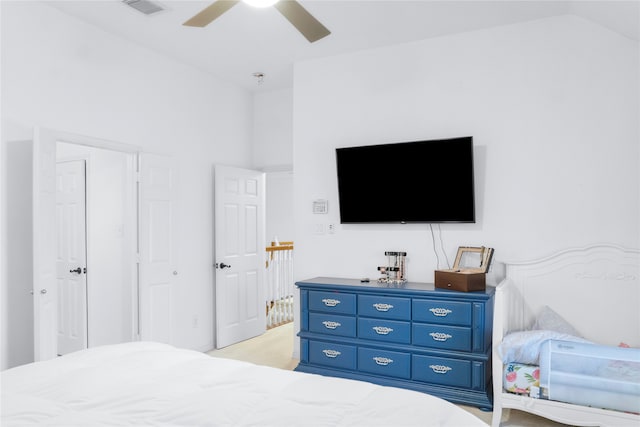 carpeted bedroom with lofted ceiling and ceiling fan