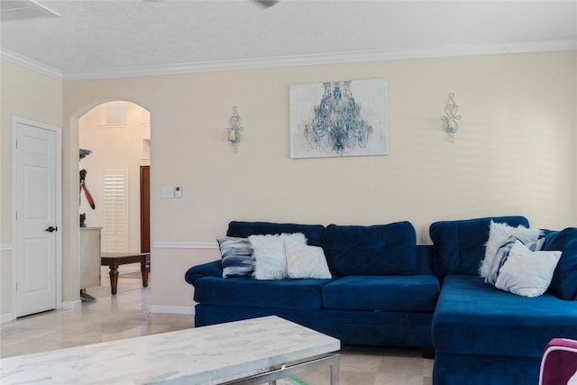 living room with a textured ceiling and ornamental molding