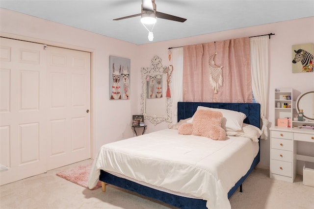 carpeted bedroom with ceiling fan