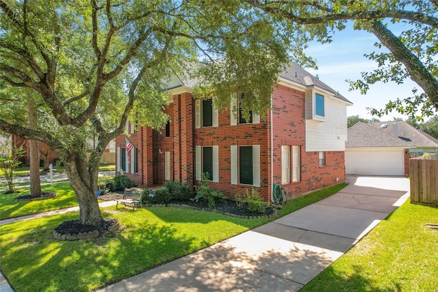 view of front of property featuring a garage and a front yard