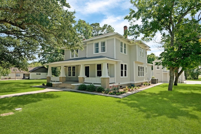 view of front of property with a front yard, central AC unit, and covered porch