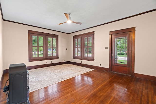 foyer featuring crown molding, ceiling fan, and dark hardwood / wood-style flooring