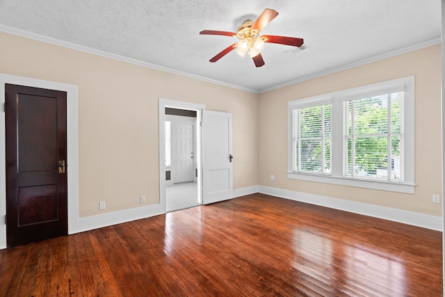 empty room with crown molding, ceiling fan, wood-type flooring, and a textured ceiling