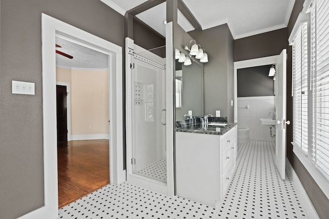 bathroom with vanity, ornamental molding, an enclosed shower, and hardwood / wood-style flooring