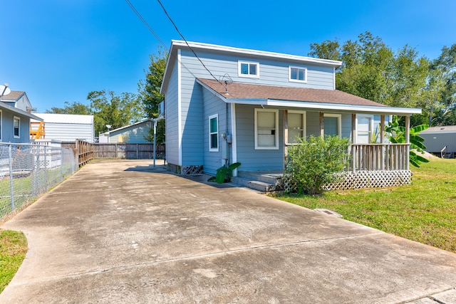 view of front of property with a front lawn and covered porch