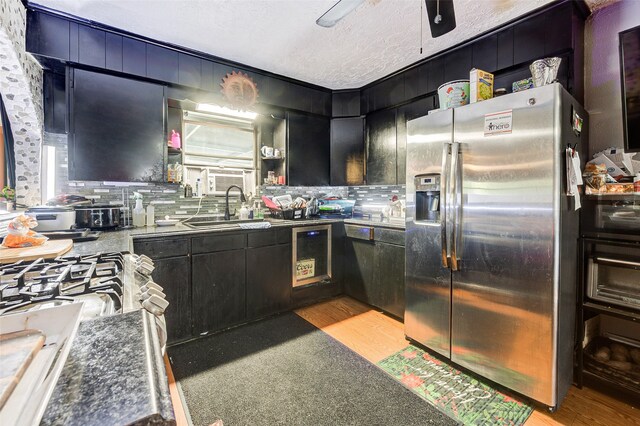 kitchen featuring light wood-type flooring, stainless steel fridge with ice dispenser, and tasteful backsplash