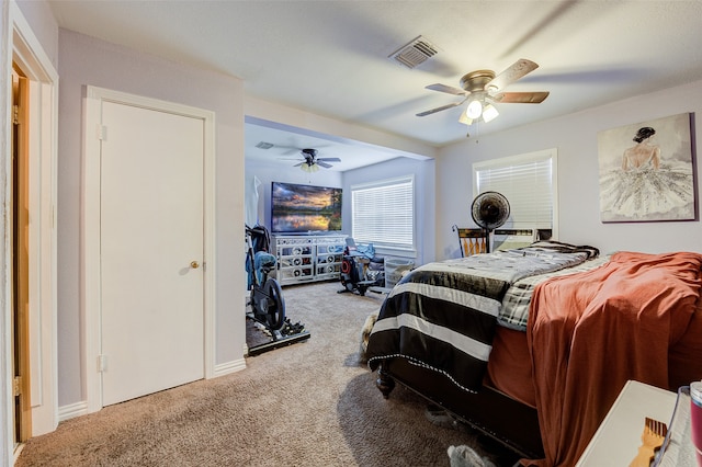 bedroom featuring ceiling fan and carpet floors