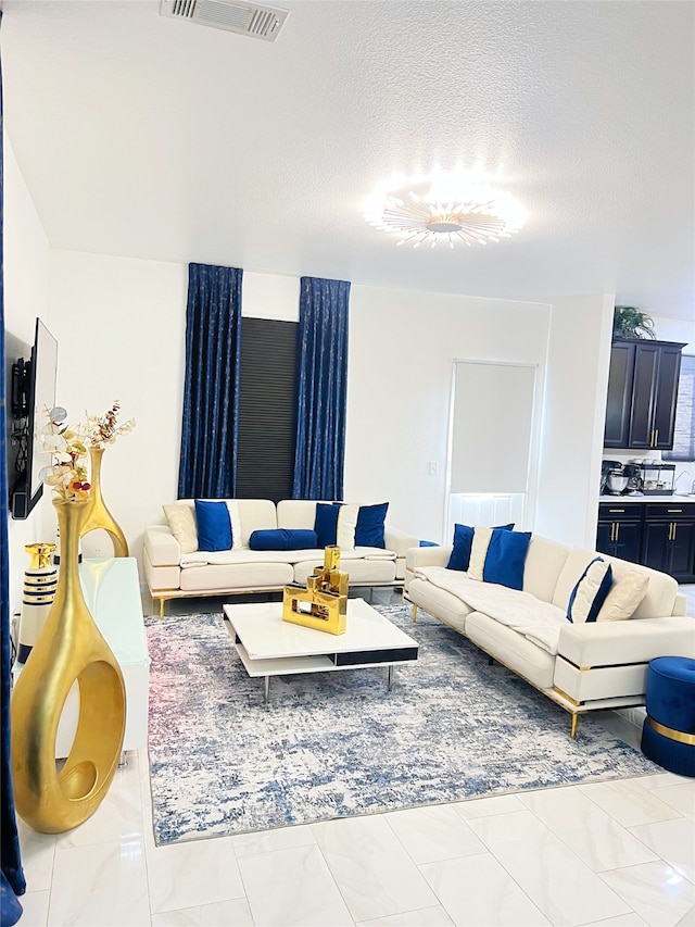 living room featuring a textured ceiling