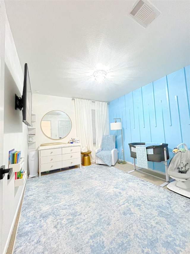 bedroom featuring a textured ceiling