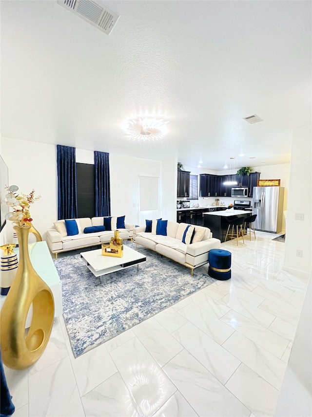 living room with a textured ceiling