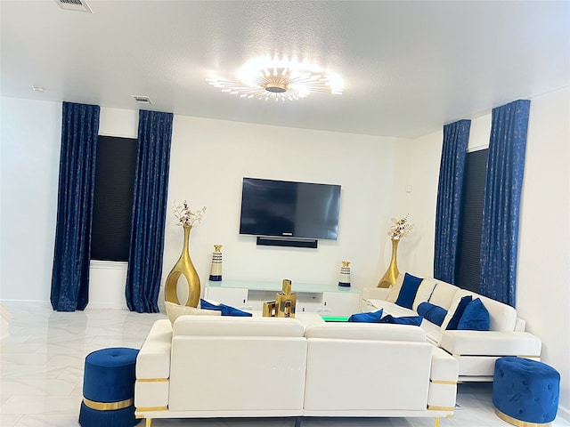 living room with a textured ceiling