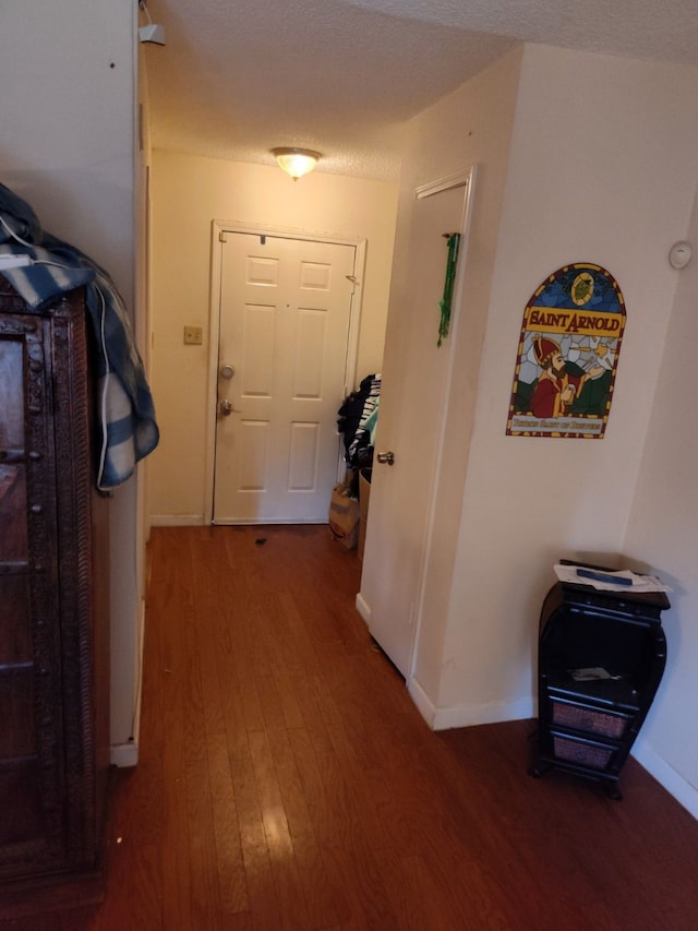 hallway with wood-type flooring