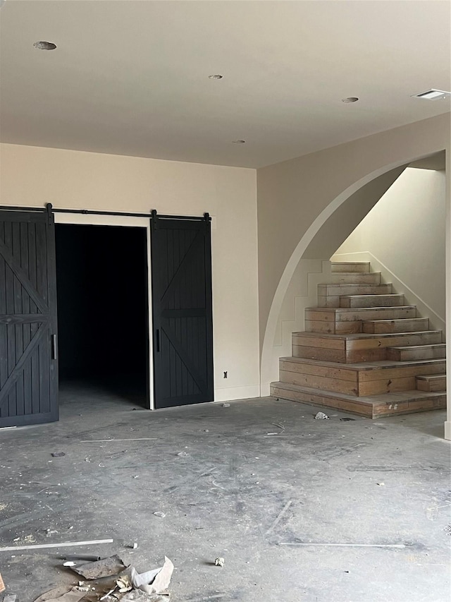 empty room featuring a barn door