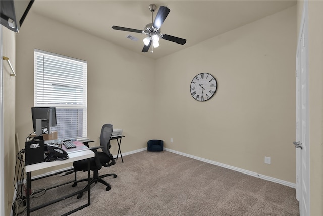 carpeted office with ceiling fan