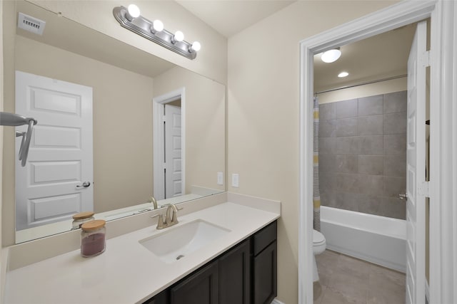 full bathroom featuring vanity, shower / bath combo with shower curtain, and toilet