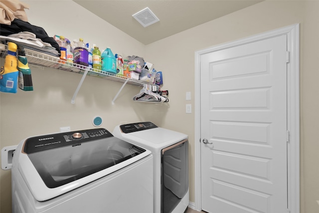 clothes washing area featuring washing machine and dryer