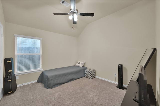 carpeted bedroom with ceiling fan and lofted ceiling