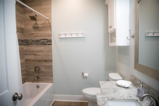 full bathroom featuring wood-type flooring, vanity, shower / tub combo, and toilet