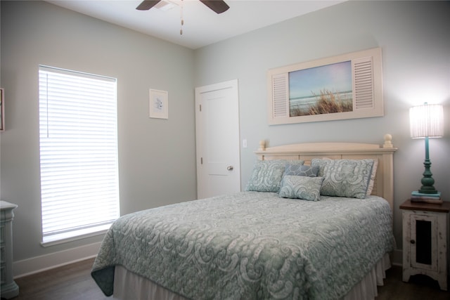 bedroom featuring dark wood-type flooring and ceiling fan