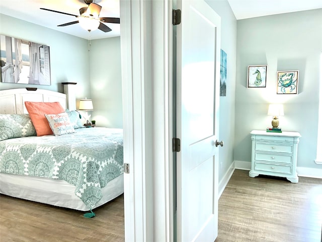 bedroom featuring hardwood / wood-style floors and ceiling fan