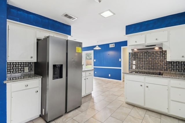 kitchen with ventilation hood, stainless steel fridge with ice dispenser, tasteful backsplash, and white cabinetry