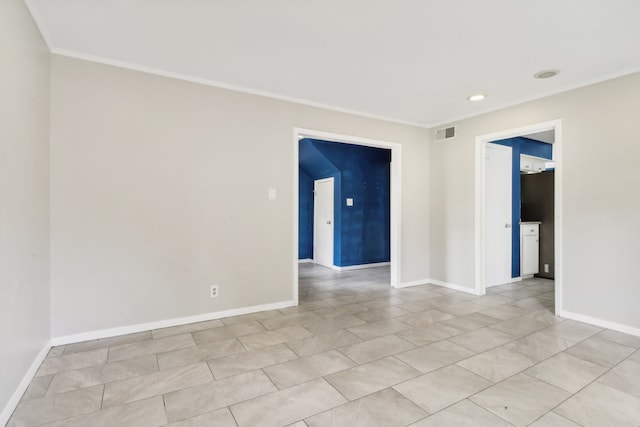 tiled empty room with ornamental molding