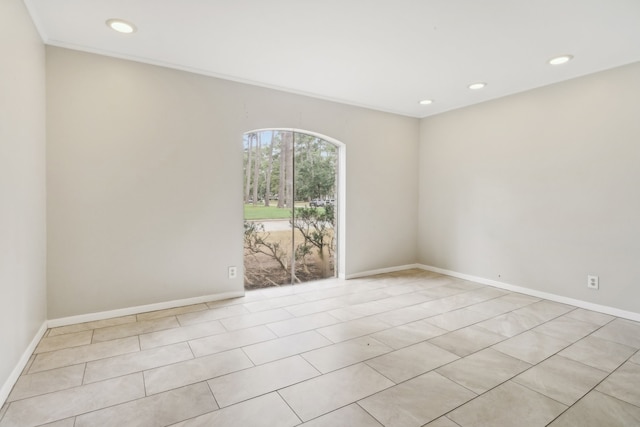 spare room featuring light tile patterned floors